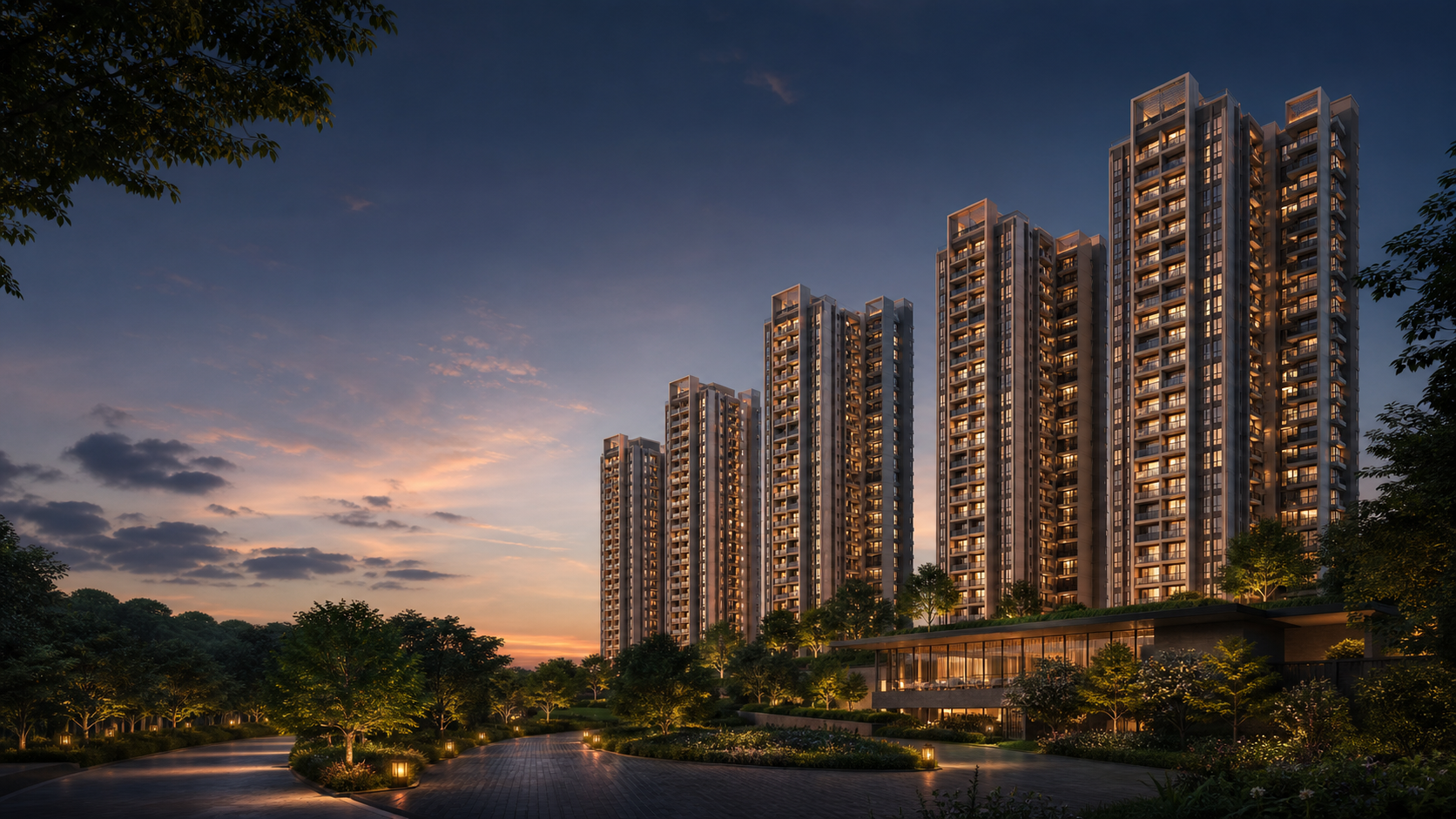 Brigade Gunjur residential towers and landscaped arrival at dusk